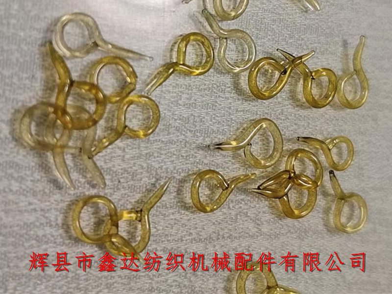 Textile equipment with tail glass ring